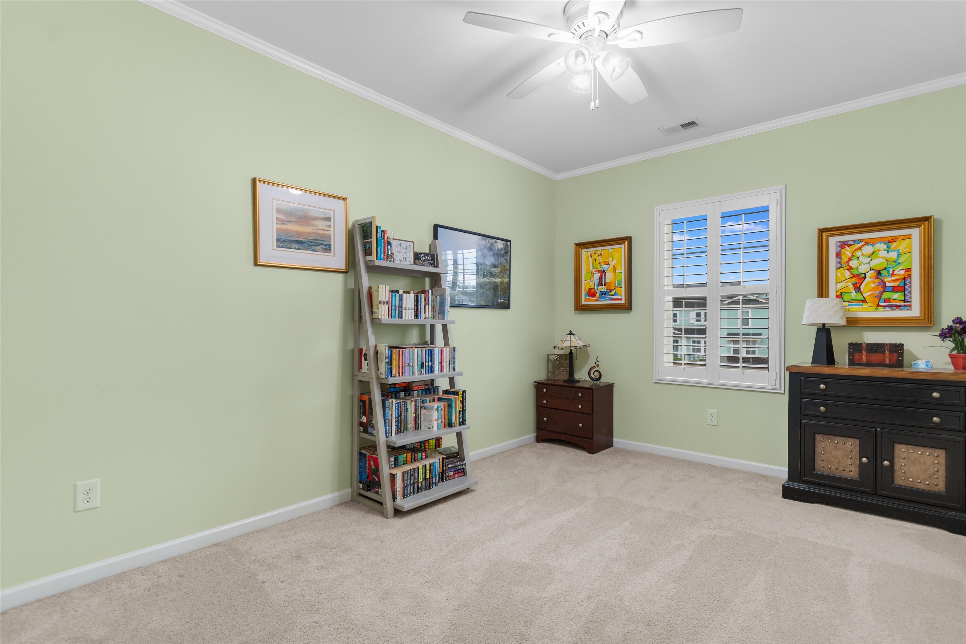 2408 Heritage Loop, Unit 2408 Myrtle Beach, SC 29577 - Photo 18 of 40 Living area featuring crown molding, light carpet, and a ceiling fan