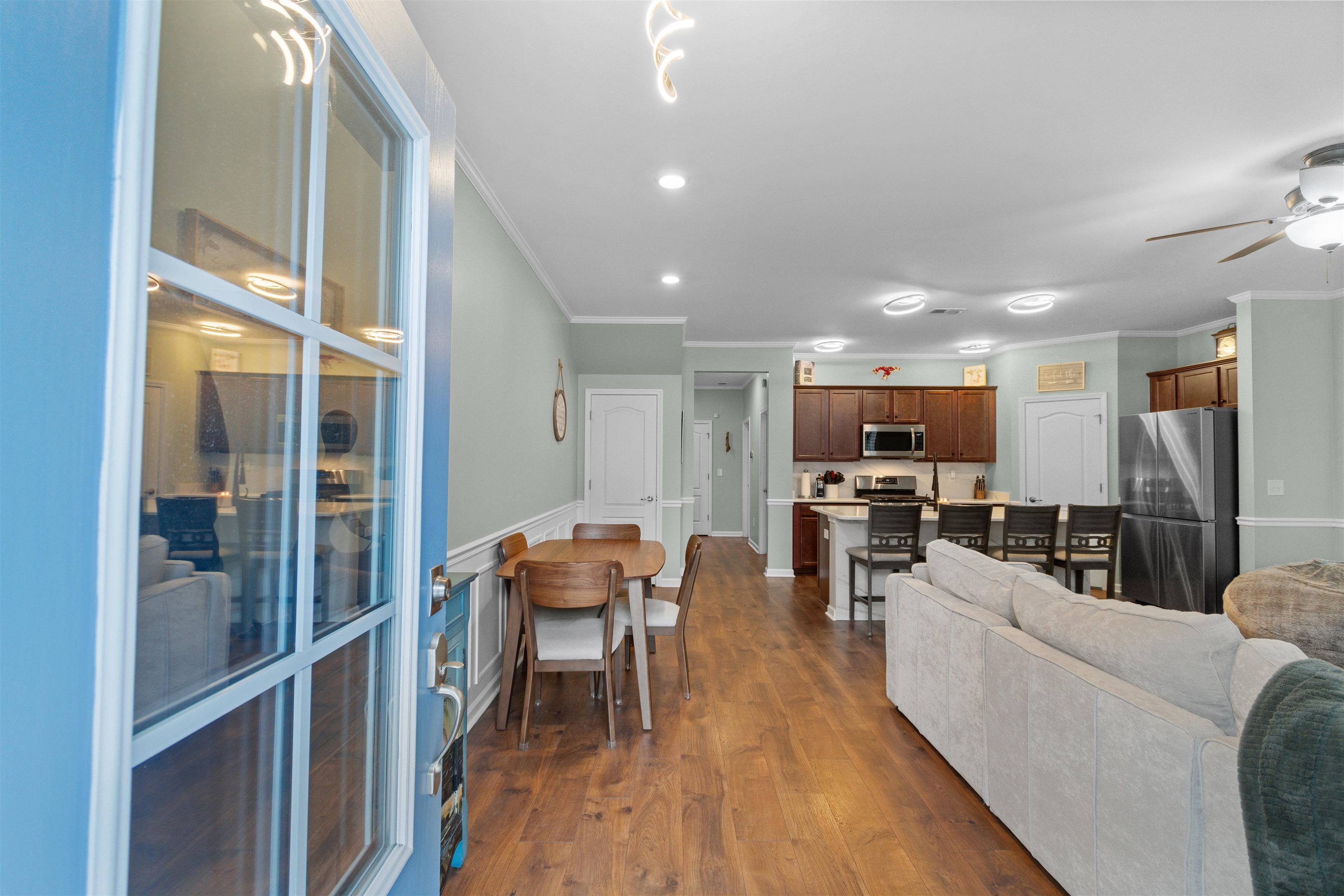 2408 Heritage Loop, Unit 2408 Myrtle Beach, SC 29577 - Photo 2 of 40 Living room featuring ornamental molding, dark wood finished floors, and a ceiling fan