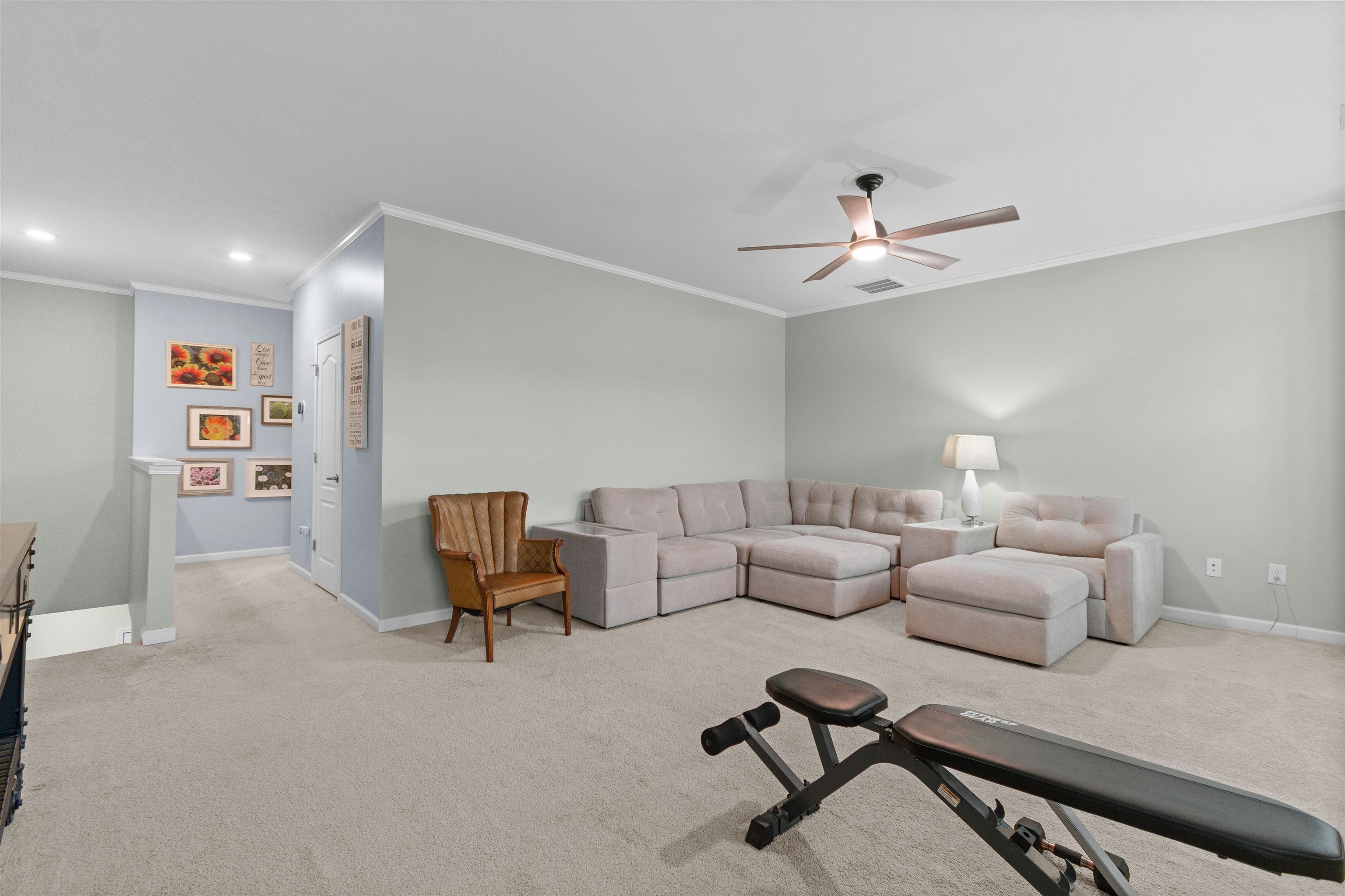 2408 Heritage Loop, Unit 2408 Myrtle Beach, SC 29577 - Photo 21 of 40 Living area with crown molding, light colored carpet, a ceiling fan, and recessed lighting