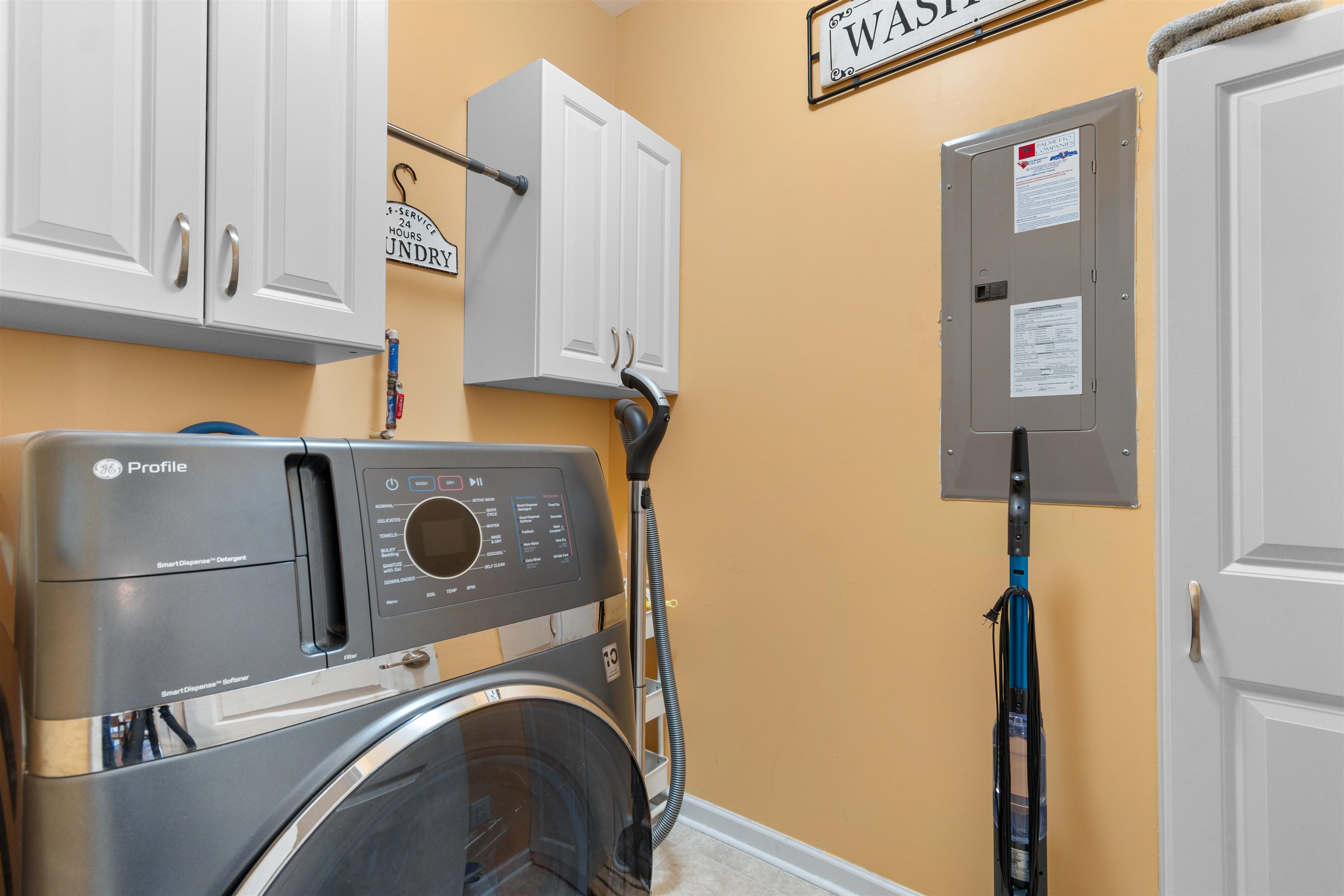 2408 Heritage Loop, Unit 2408 Myrtle Beach, SC 29577 - Photo 25 of 40 Washroom featuring washer / clothes dryer, electric panel, and cabinet space