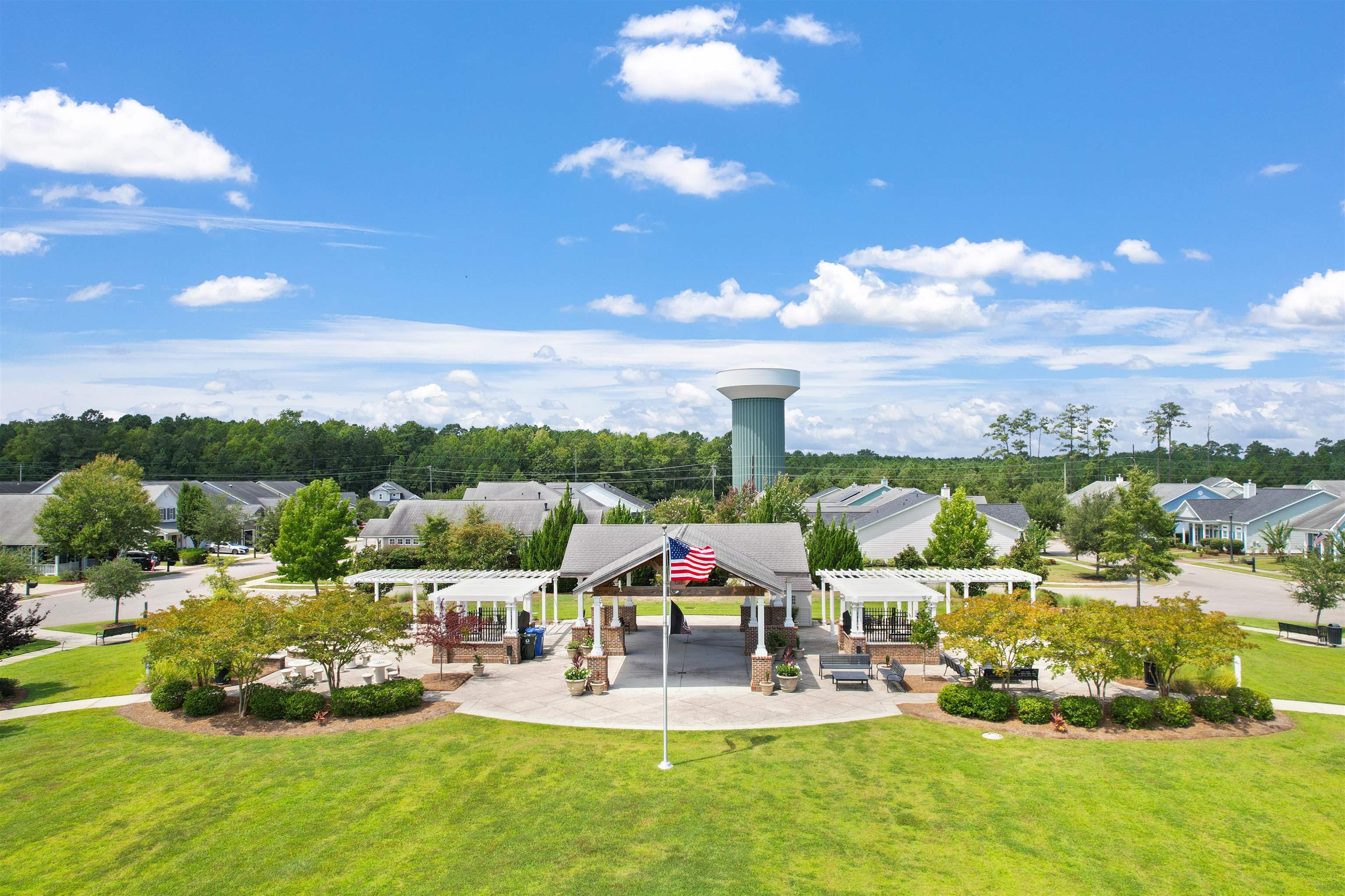 2408 Heritage Loop, Unit 2408 Myrtle Beach, SC 29577 - Photo 33 of 40 View of community with a pergola, a yard, a patio area, and a residential view