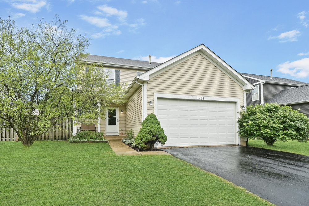 front view of a house and a yard