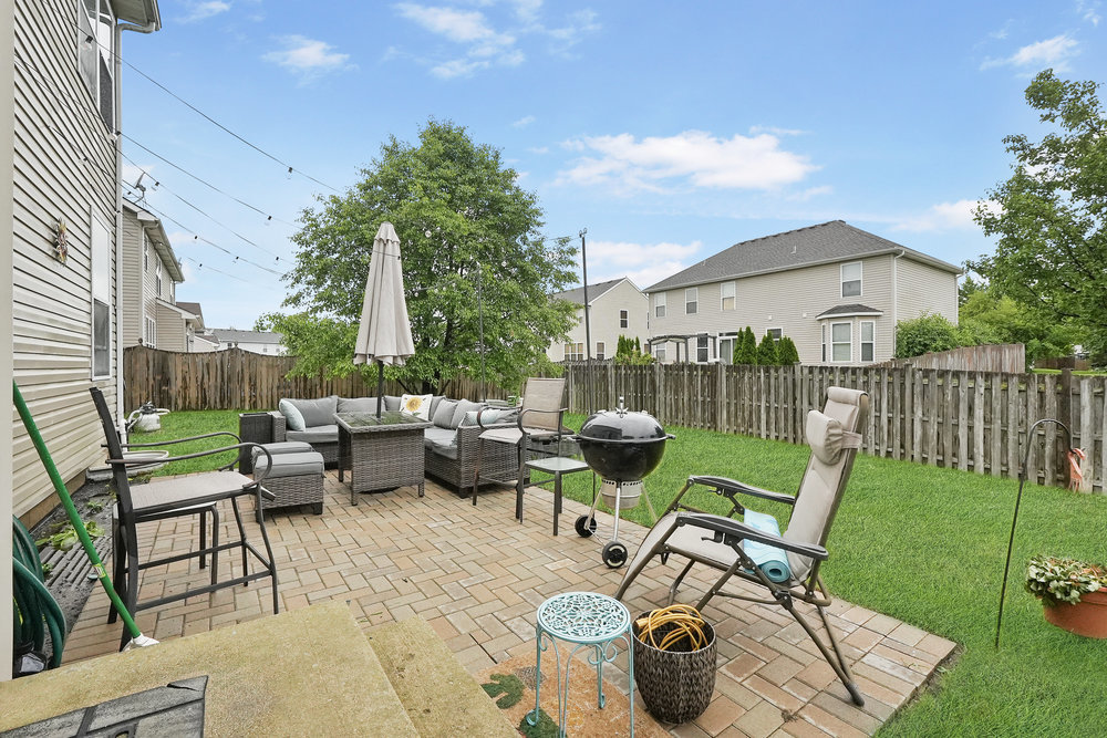 1962 Ashbrooke Road Romeoville, IL 60446 - Photo 16 of 21 a view of backyard with outdoor seating and green space