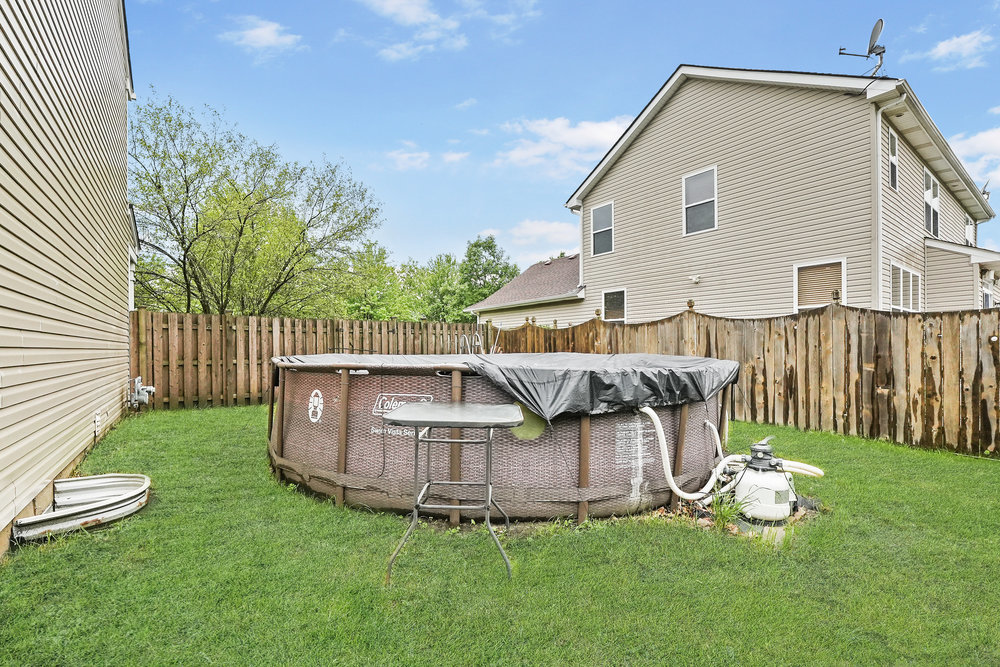 1962 Ashbrooke Road Romeoville, IL 60446 - Photo 18 of 21 a view of a house with backyard and porch