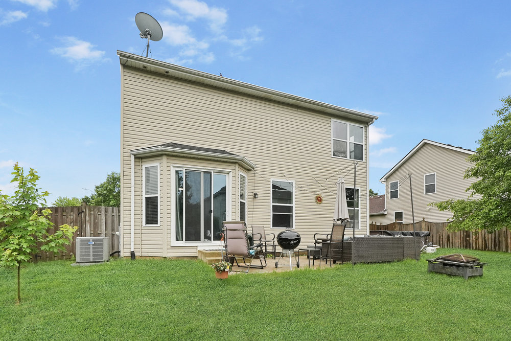 1962 Ashbrooke Road Romeoville, IL 60446 - Photo 19 of 21 a view of a house with backyard and sitting area
