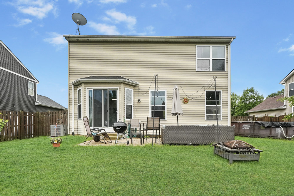 1962 Ashbrooke Road Romeoville, IL 60446 - Photo 20 of 21 a front view of a house with a garden