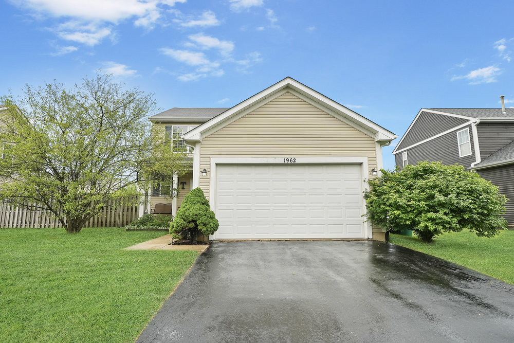 1962 Ashbrooke Road Romeoville, IL 60446 - Photo 21 of 21 a view of a house with a yard