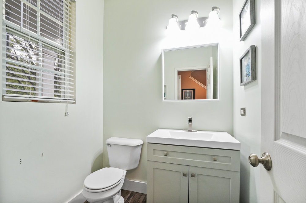 1962 Ashbrooke Road Romeoville, IL 60446 - Photo 8 of 21 a bathroom with a toilet sink and mirror