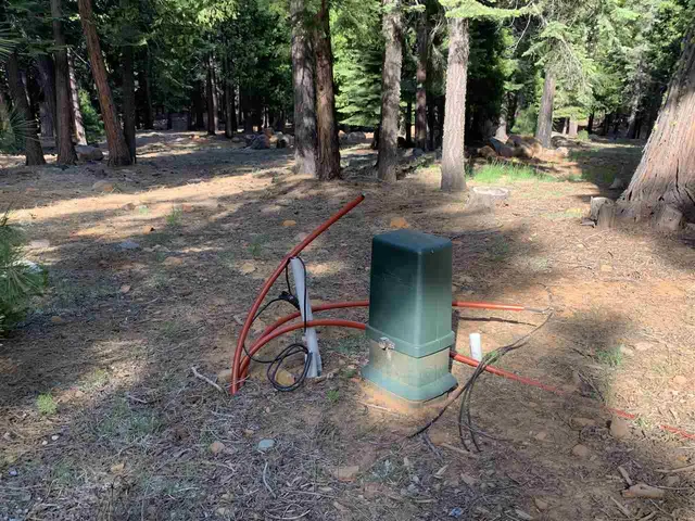 a view of outdoor space with playground and green space