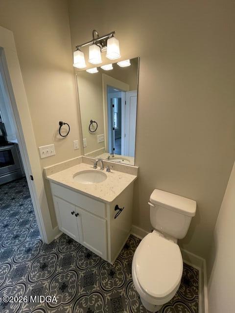 1121 Columbus Street, Unit A Macon, GA 31201 - Photo 6 of 6 a bathroom with a sink mirror vanity and toilet