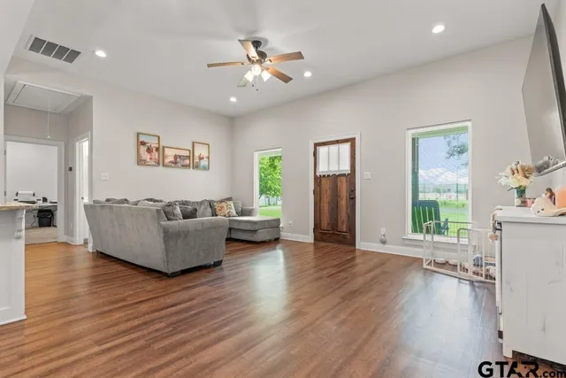 a living room with furniture and a large window