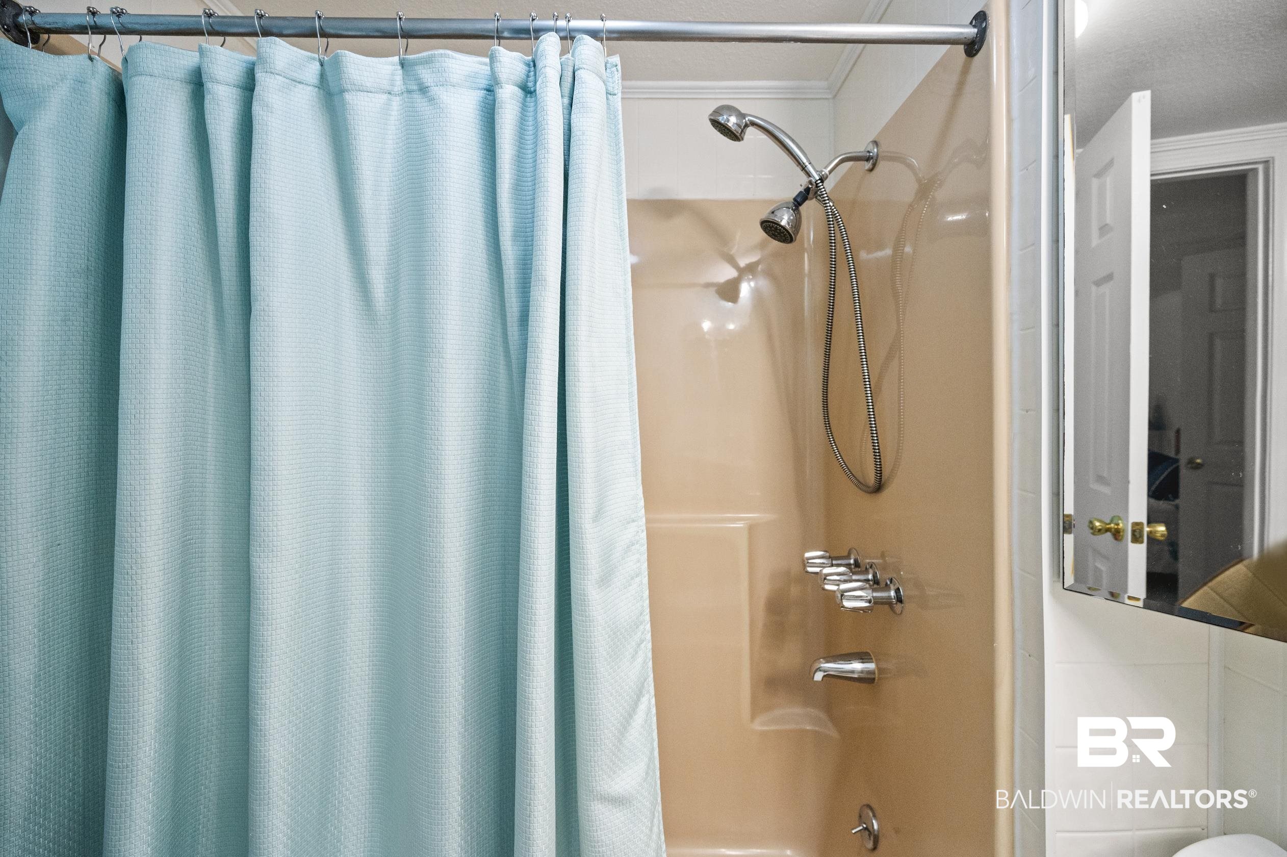 5392 Ornacor Avenue Orange Beach, AL 36561 - Photo 24 of 48 Bathroom with crown molding and shower / bathtub combination with curtain