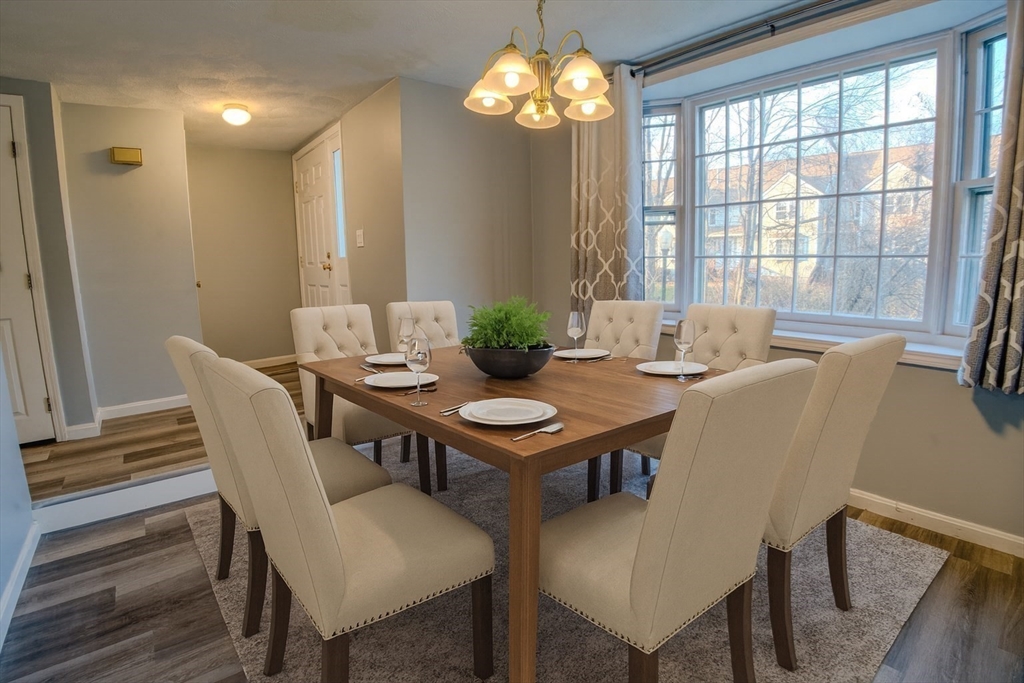43 Patrick Road, Unit 43 Tewksbury, MA 01876 - Photo 12 of 27 a view of a dining room with furniture window and outside view