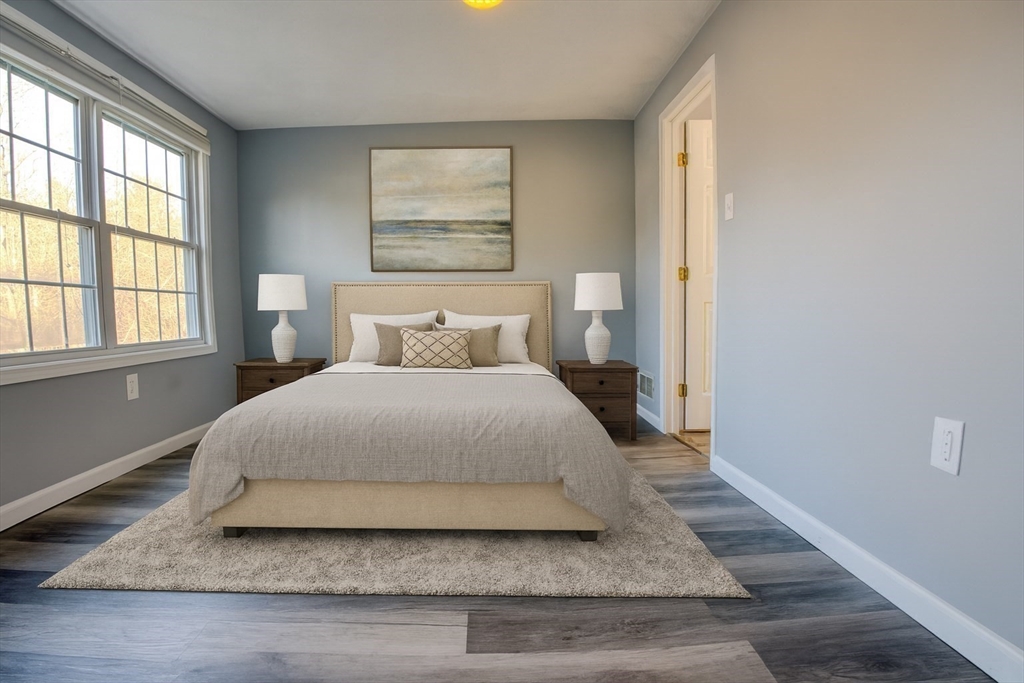 43 Patrick Road, Unit 43 Tewksbury, MA 01876 - Photo 21 of 27 a bedroom with a bed and a window