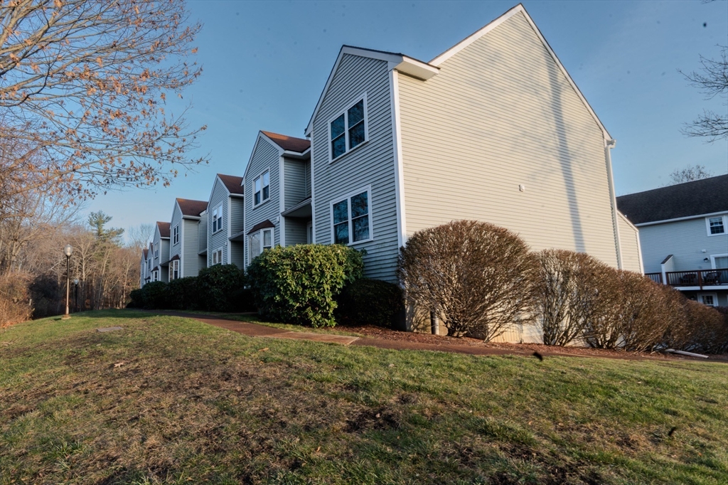 43 Patrick Road, Unit 43 Tewksbury, MA 01876 - Photo 3 of 27 a view of a house with a yard