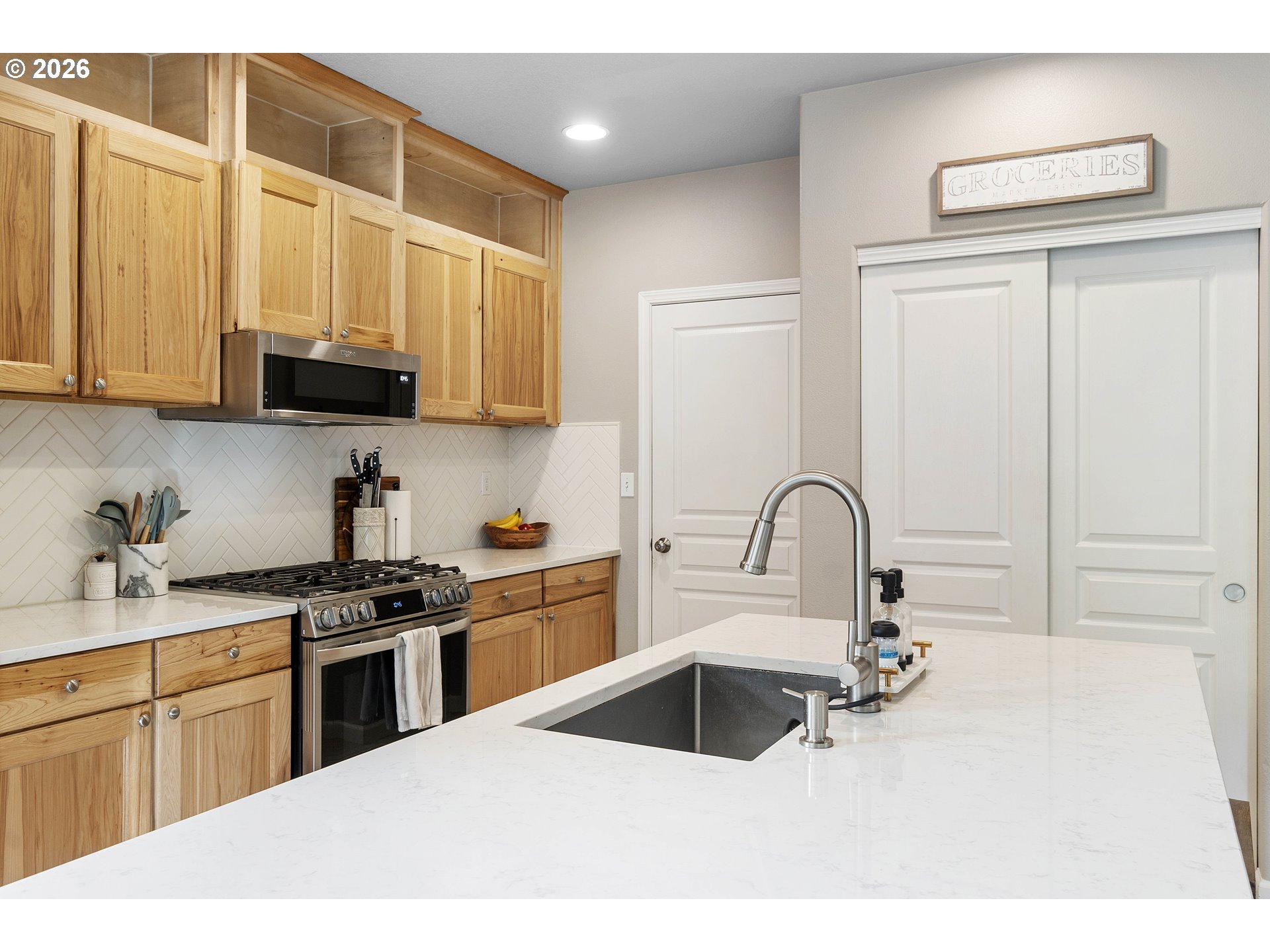 15520 Rainier Avenue Sandy, OR 97055 - Photo 14 of 38 a kitchen with a sink a stove and cabinets