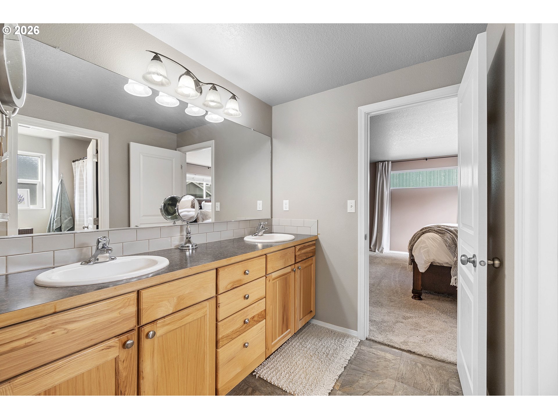15520 Rainier Avenue Sandy, OR 97055 - Photo 21 of 38 a bathroom with a sink double vanity and a mirror