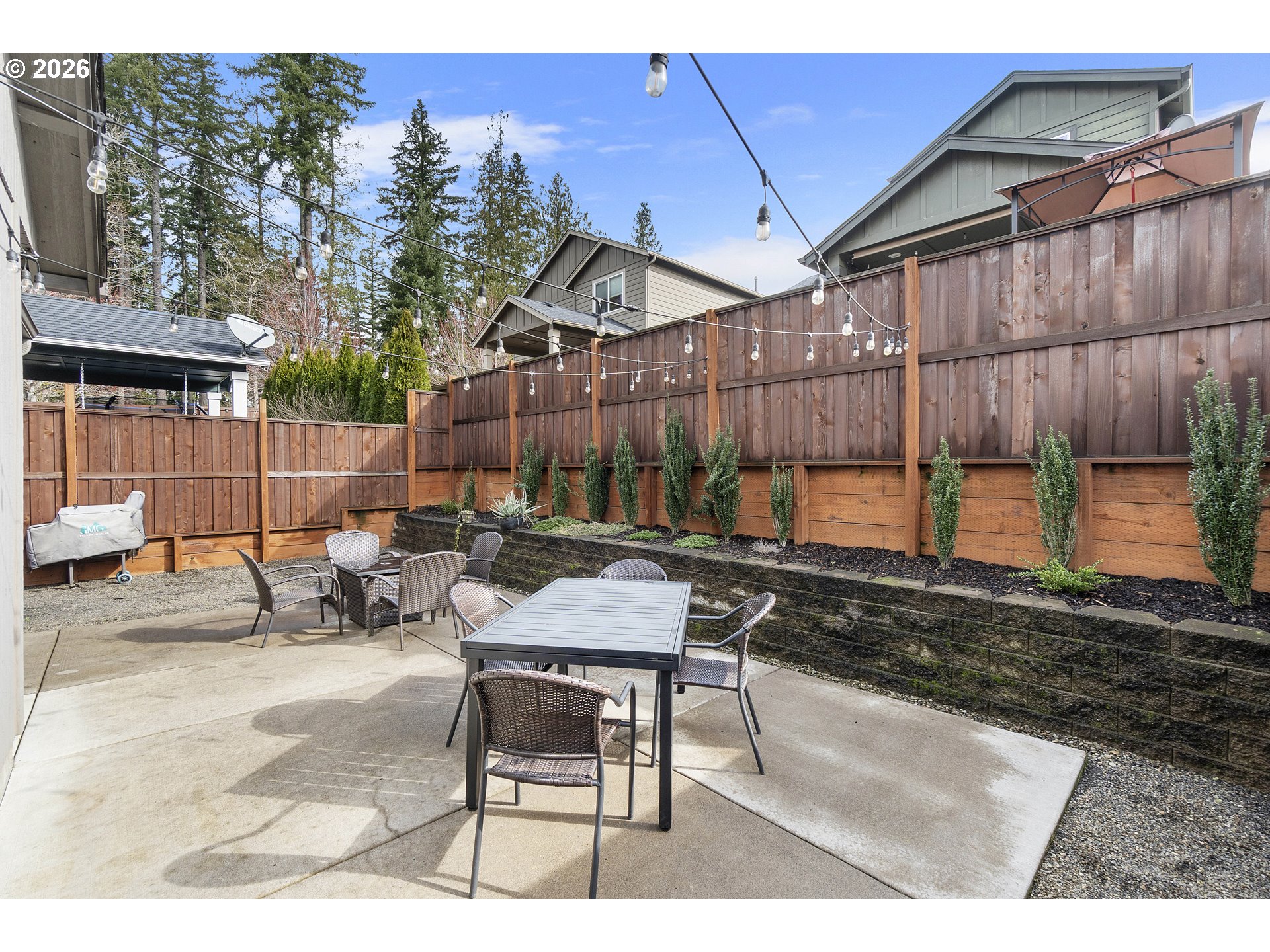 15520 Rainier Avenue Sandy, OR 97055 - Photo 27 of 38 a backyard of a house with table and chairs