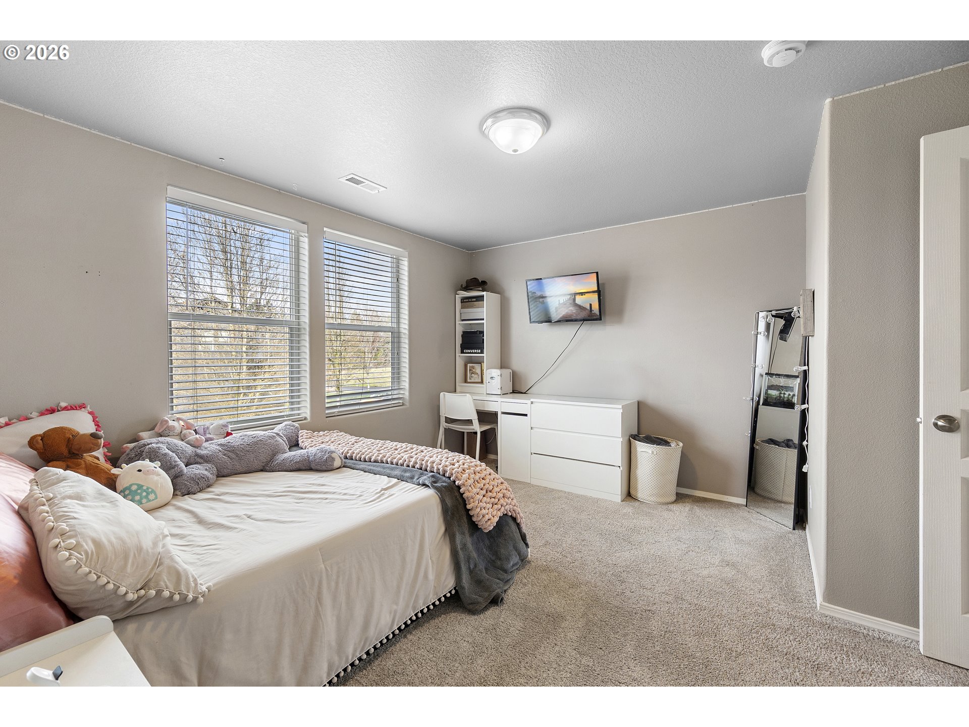 15520 Rainier Avenue Sandy, OR 97055 - Photo 29 of 38 a bedroom with a bed and a large window
