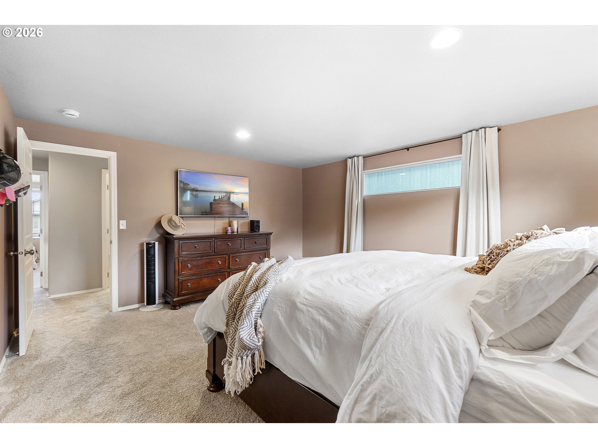 15520 Rainier Avenue Sandy, OR 97055 - Photo 30 of 38 a bedroom with a bed and a flat screen tv