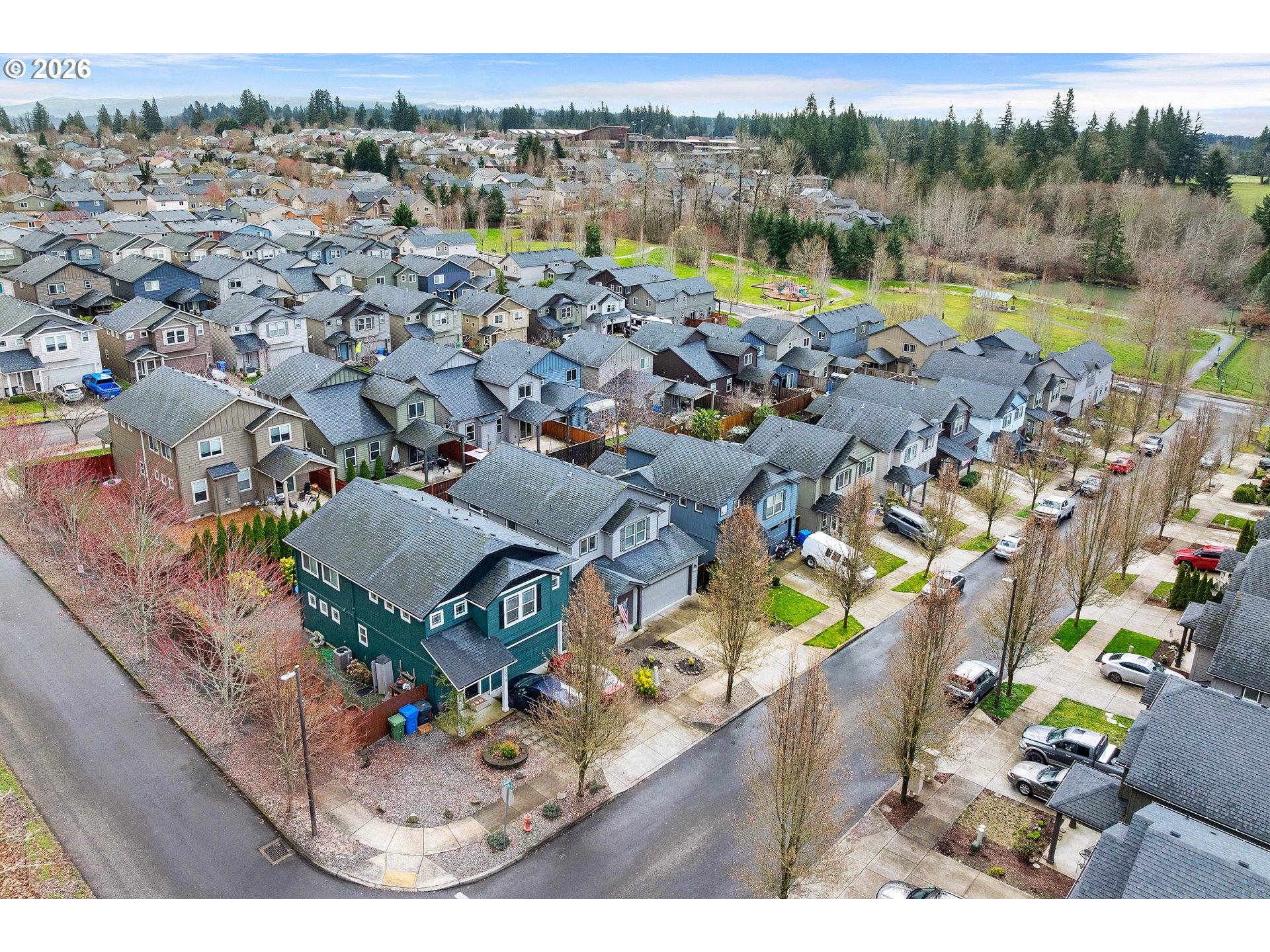 15520 Rainier Avenue Sandy, OR 97055 - Photo 32 of 38 an aerial view of a house with a swimming pool a yard and mountain view