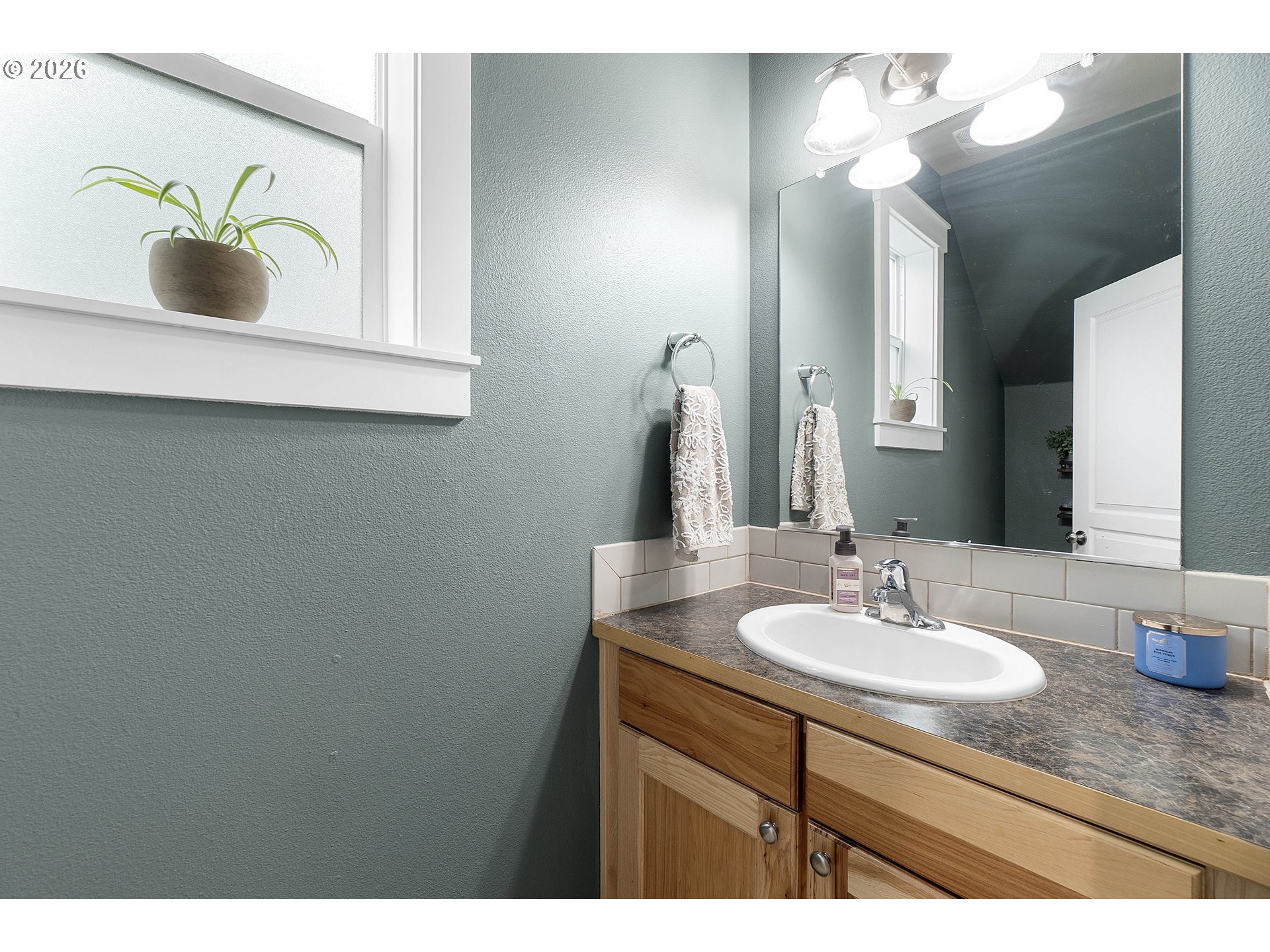15520 Rainier Avenue Sandy, OR 97055 - Photo 6 of 38 a bathroom with a sink and a mirror