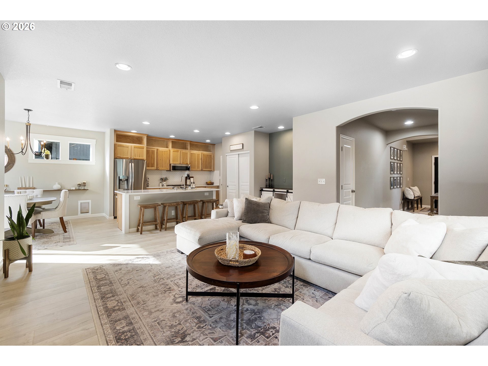 15520 Rainier Avenue Sandy, OR 97055 - Photo 9 of 38 a living room with furniture and a dining table with wooden floor