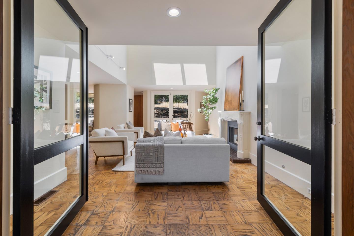 3364 Woodside Road Woodside, CA 94062 - Photo 13 of 48 a living room with furniture and large windows