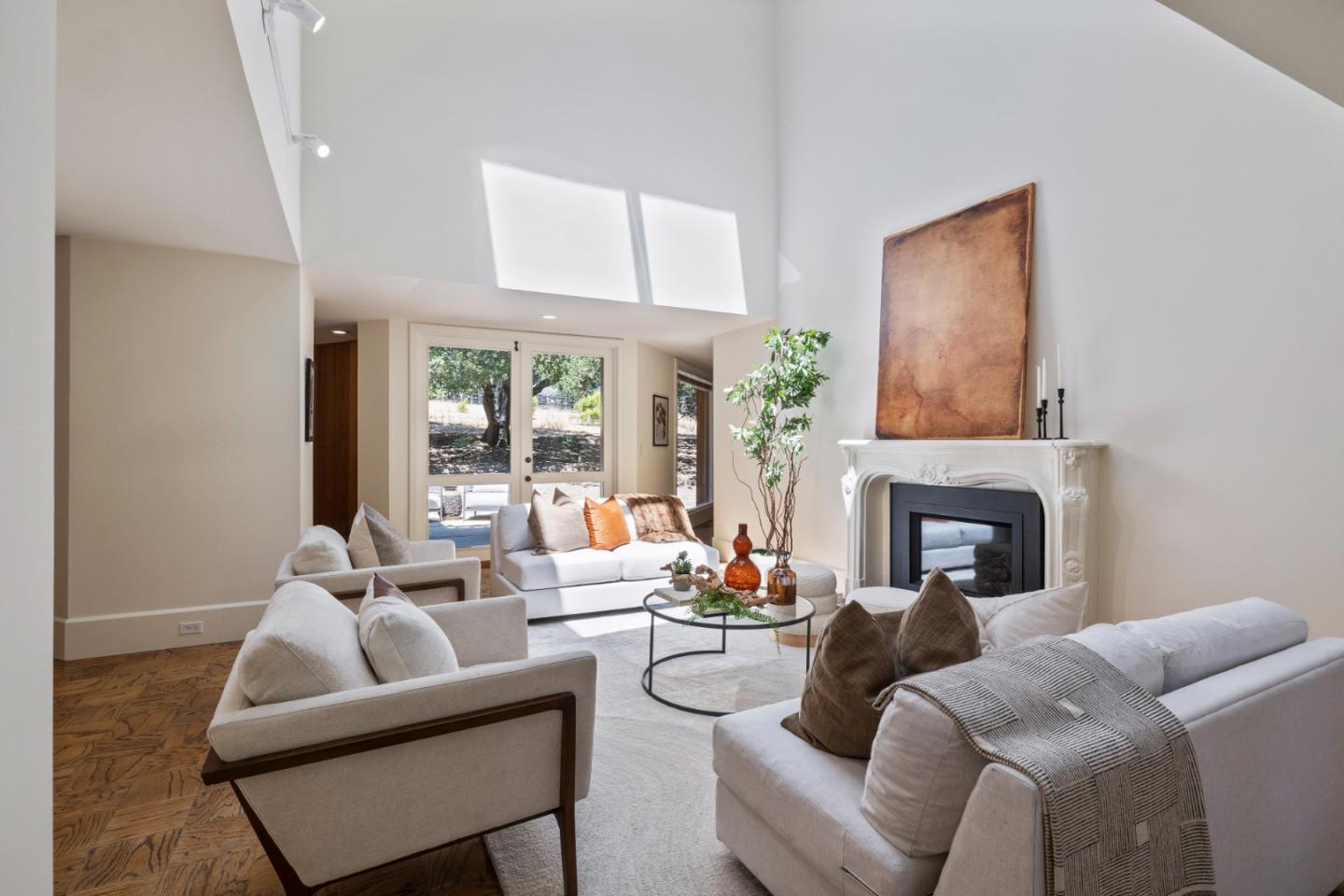 3364 Woodside Road Woodside, CA 94062 - Photo 14 of 48 a living room with furniture a fireplace and a large window