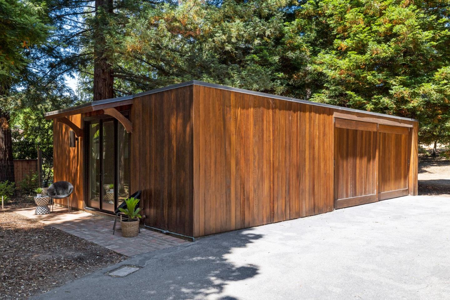 3364 Woodside Road Woodside, CA 94062 - Photo 39 of 48 a view of a backyard with potted plants and a small yard