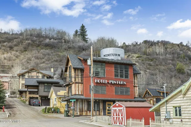 a view of a field with an ocean