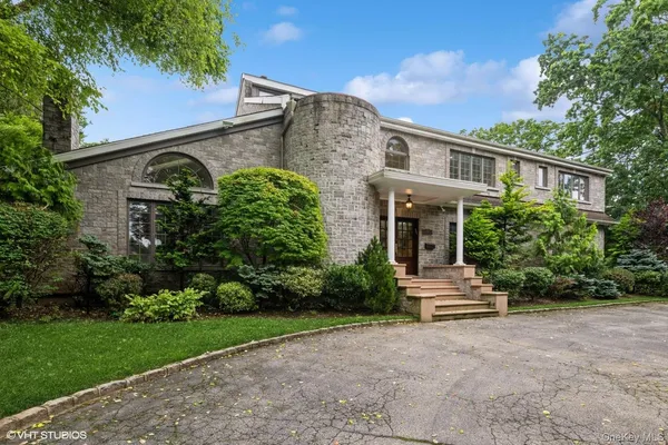 a front view of a house with garden
