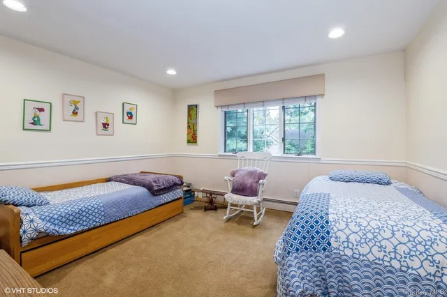 a bedroom with a bed and chair