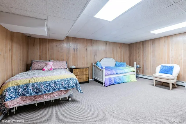 a bedroom with furniture and a chair