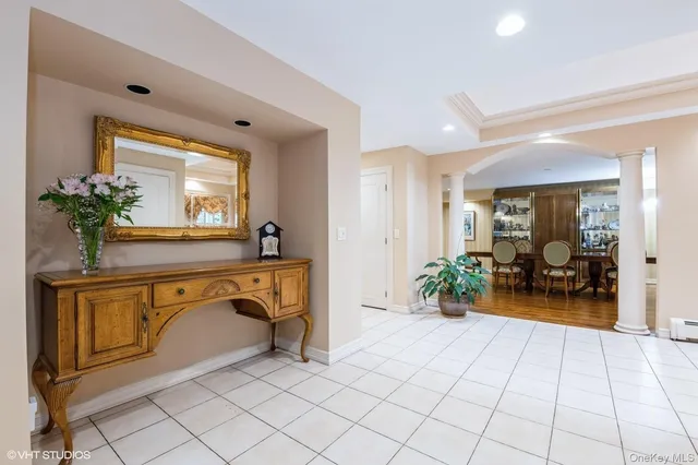 a view of living room with furniture and a potted plant