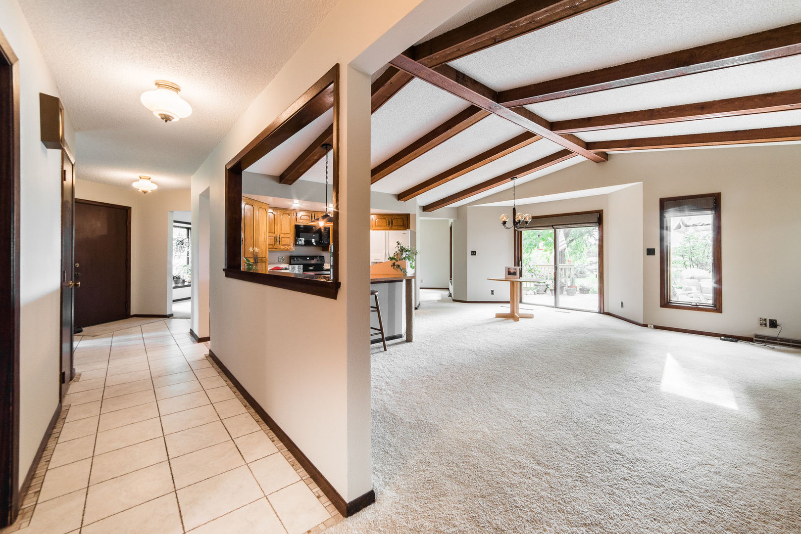 16045 Whipple Road Sycamore, IL 60178 - Photo 19 of 60 a view of a hallway with wooden floor and a living room
