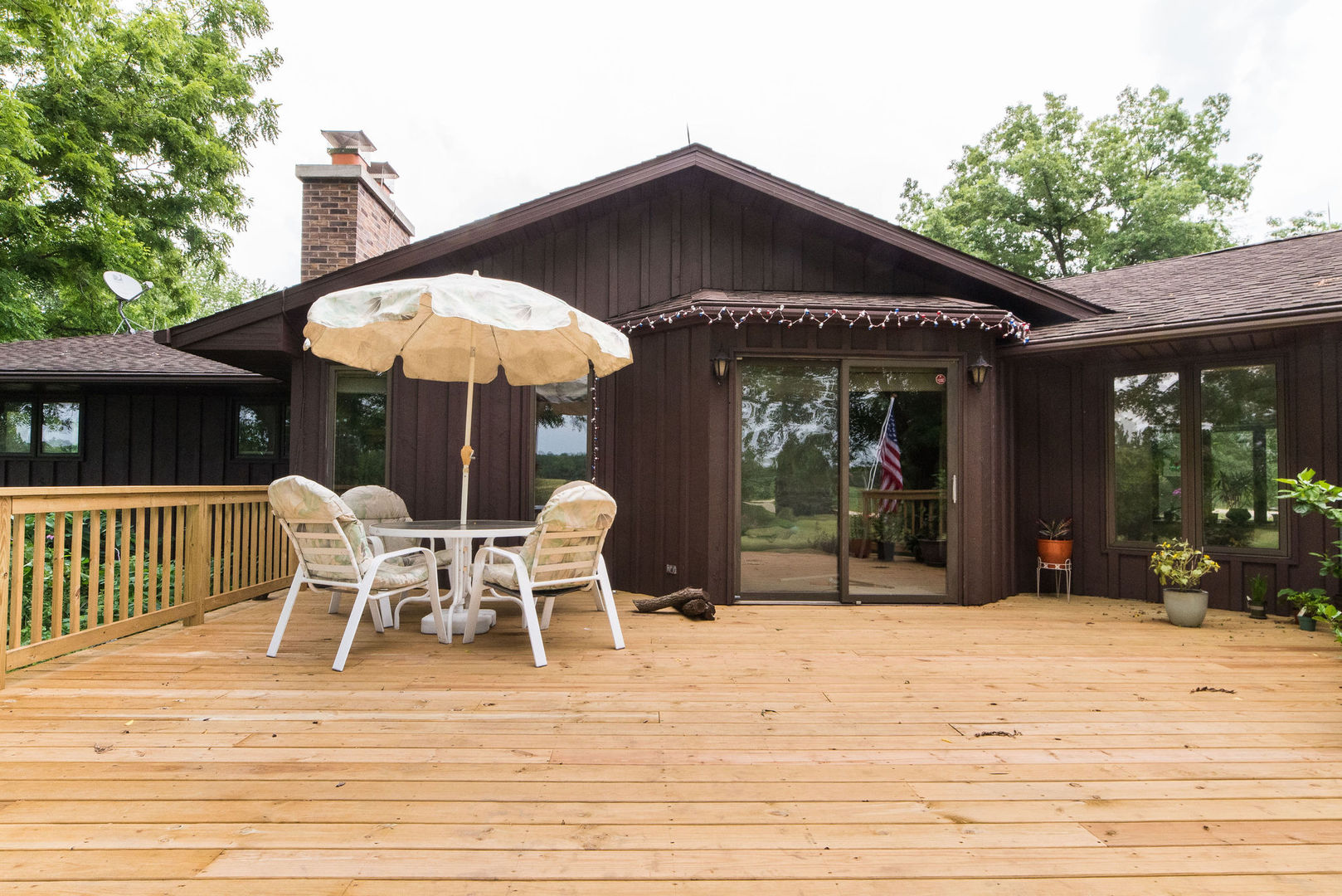 16045 Whipple Road Sycamore, IL 60178 - Photo 37 of 60 a view of a chair and tables in the patio in front of house