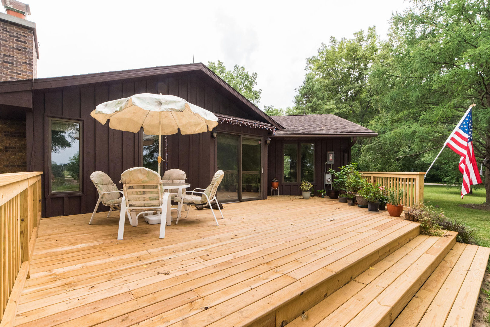 16045 Whipple Road Sycamore, IL 60178 - Photo 38 of 60 a view of a roof deck with table and chairs