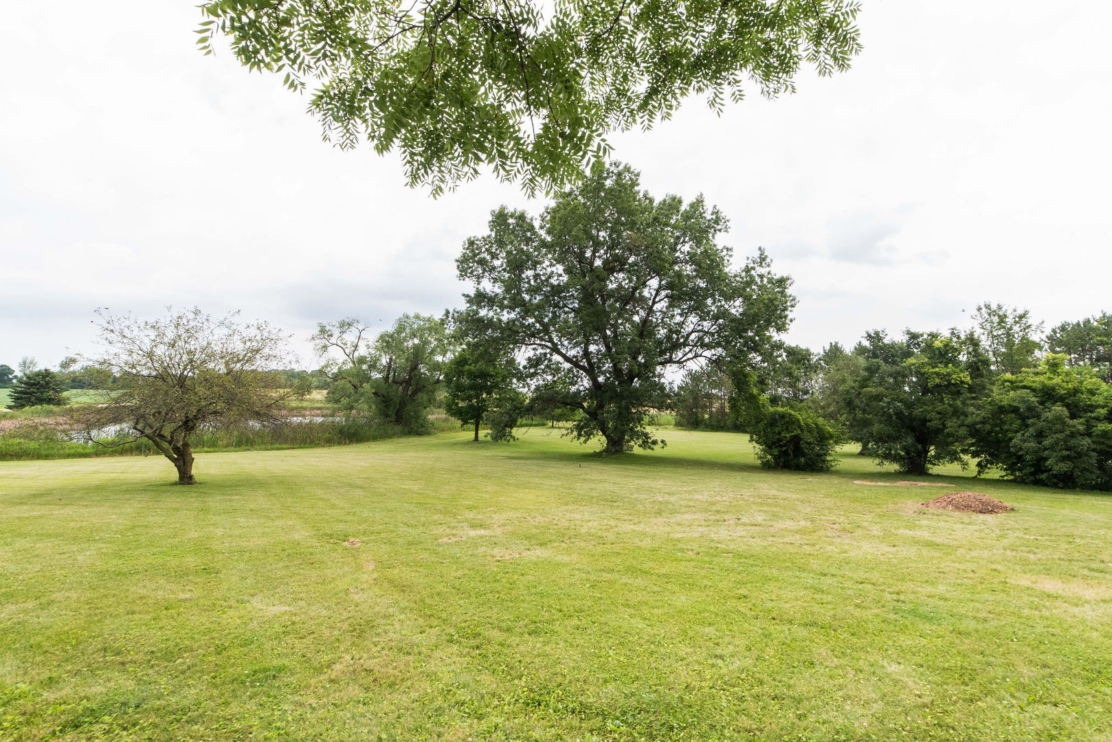 16045 Whipple Road Sycamore, IL 60178 - Photo 50 of 60 a view of an ocean yard and mountain view in back