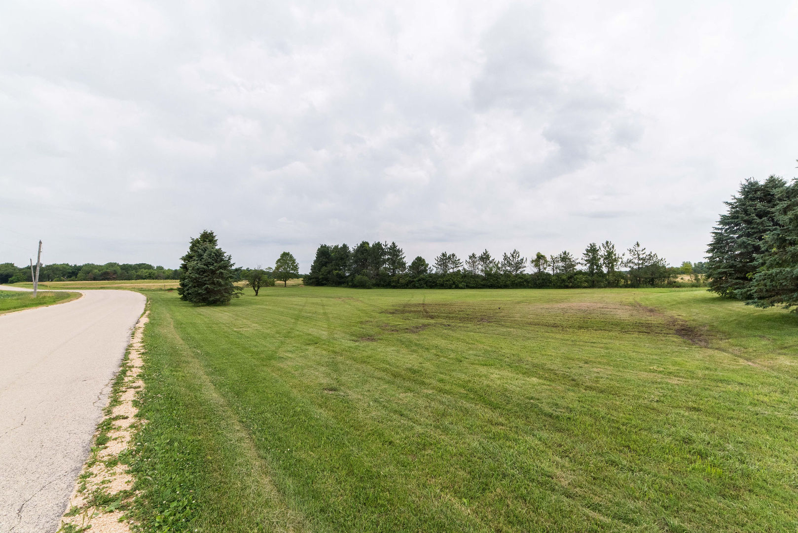 16045 Whipple Road Sycamore, IL 60178 - Photo 52 of 60 a view of a lake with houses in the back