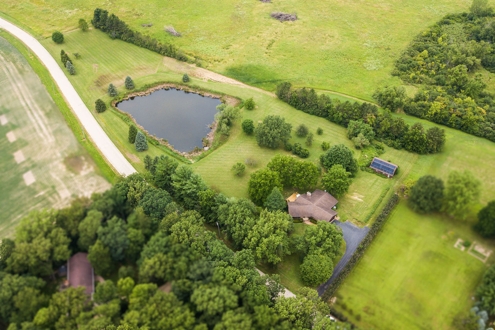 16045 Whipple Road Sycamore, IL 60178 - Photo 56 of 60 a view of a lake with a yard