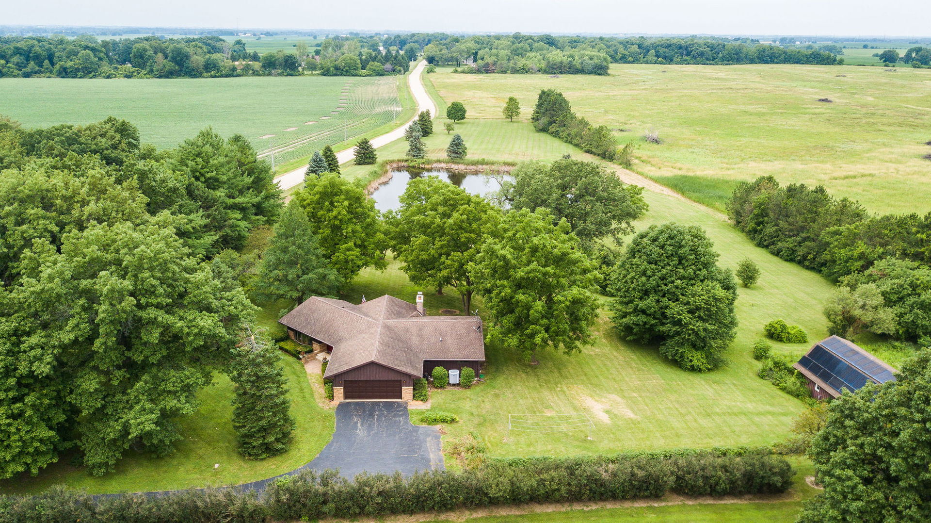 16045 Whipple Road Sycamore, IL 60178 - Photo 58 of 60 an aerial view of a house with a yard and lake view