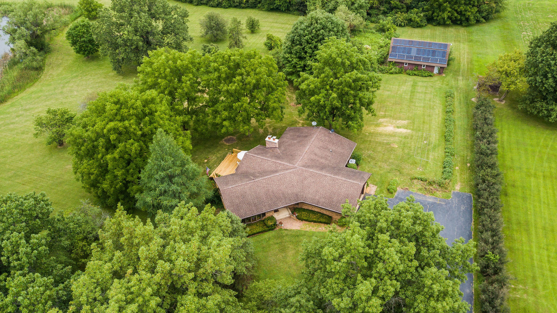 16045 Whipple Road Sycamore, IL 60178 - Photo 59 of 60 an aerial view of a house with pool yard outdoor seating and yard