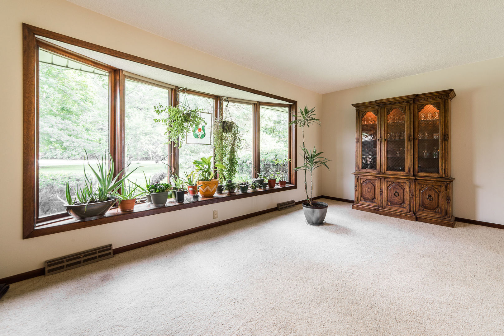 16045 Whipple Road Sycamore, IL 60178 - Photo 8 of 60 wooden floor in an empty room with windows