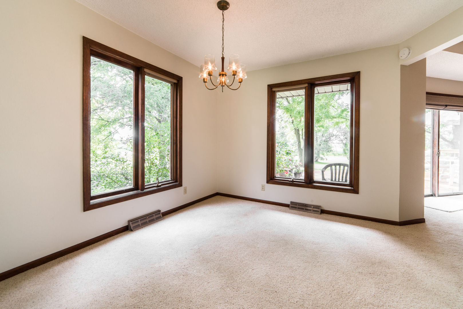 16045 Whipple Road Sycamore, IL 60178 - Photo 9 of 60 a view of livingroom with window ceiling fan and hallway