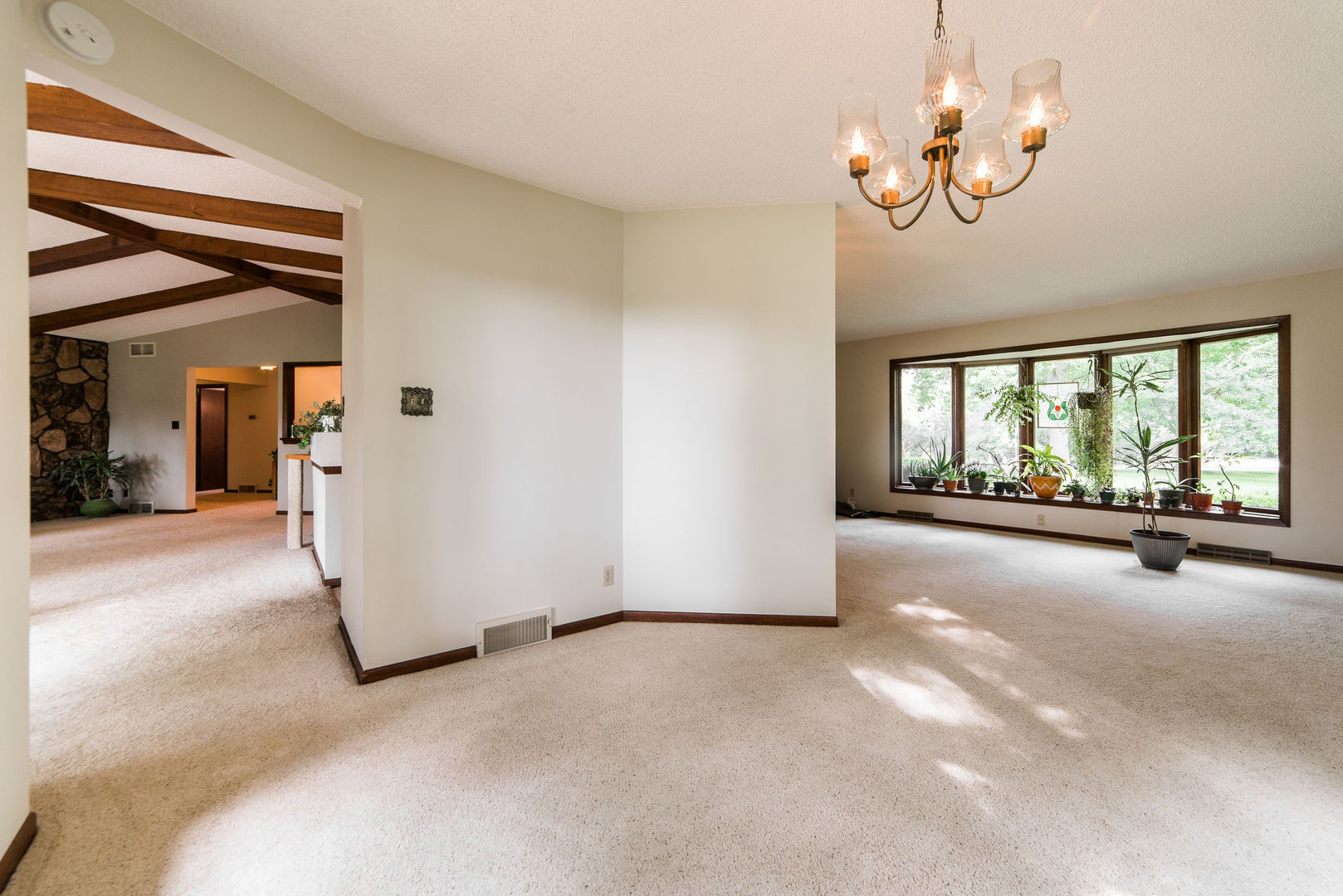 16045 Whipple Road Sycamore, IL 60178 - Photo 10 of 60 a view of a livingroom with a ceiling fan and window