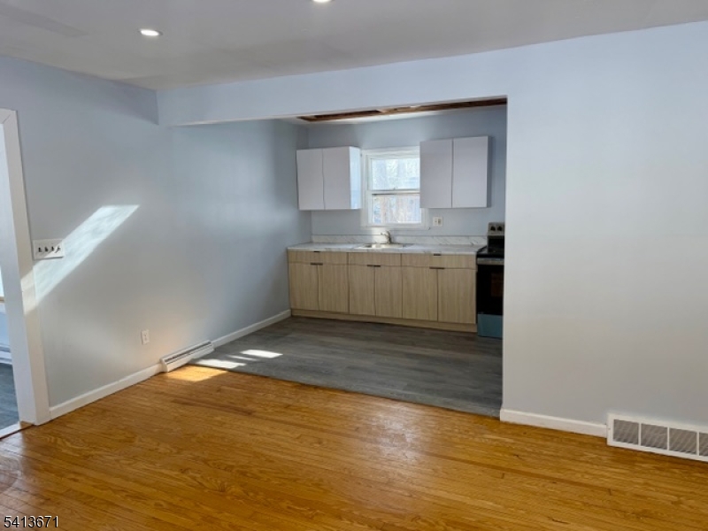 56 Appleseed Road Vernon, NJ 07461 - Photo 3 of 8 a room with a sink cabinets and wooden floor