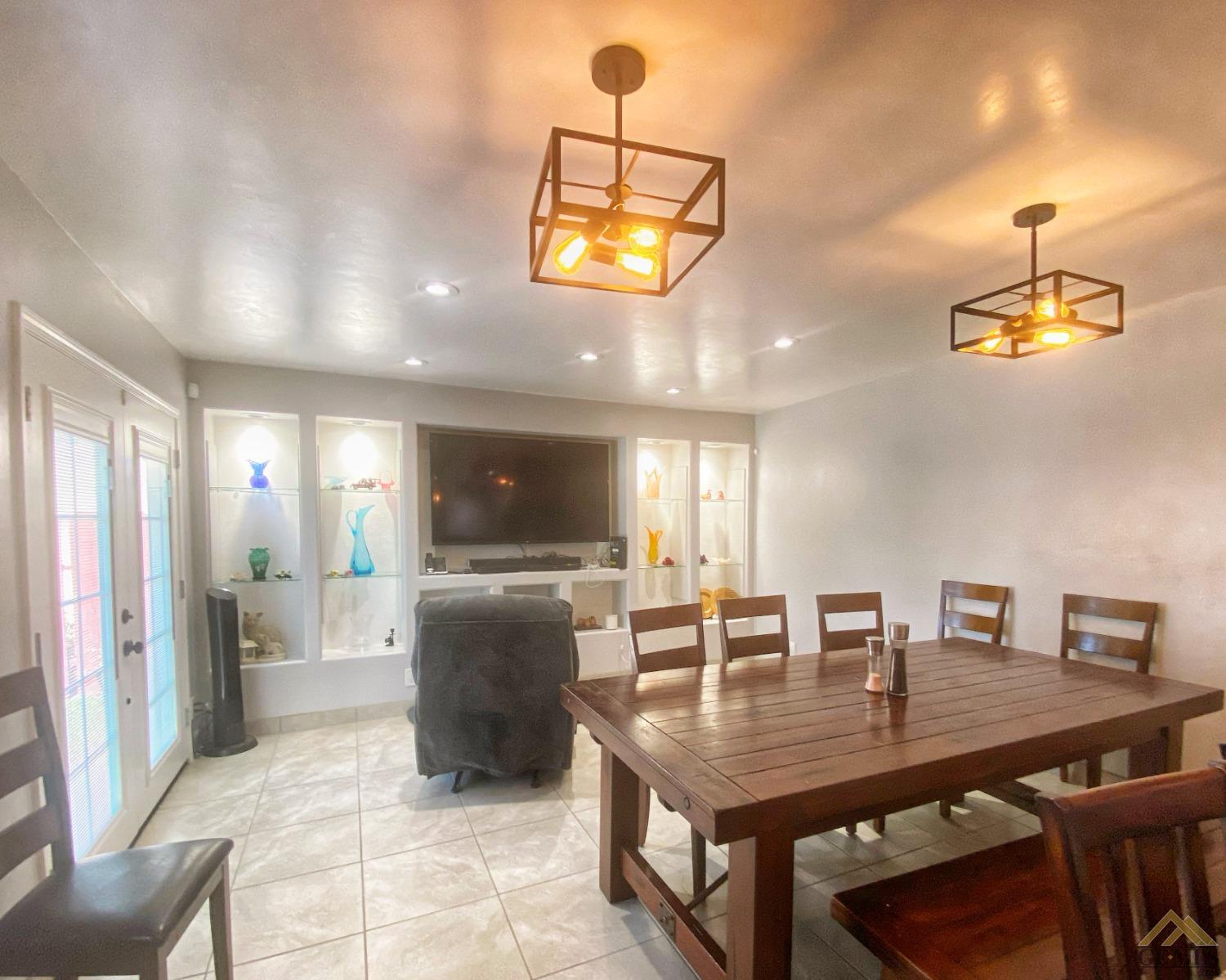 Undisclosed Address Wasco, CA 93280 - Photo 15 of 40 a kitchen with a table and chairs