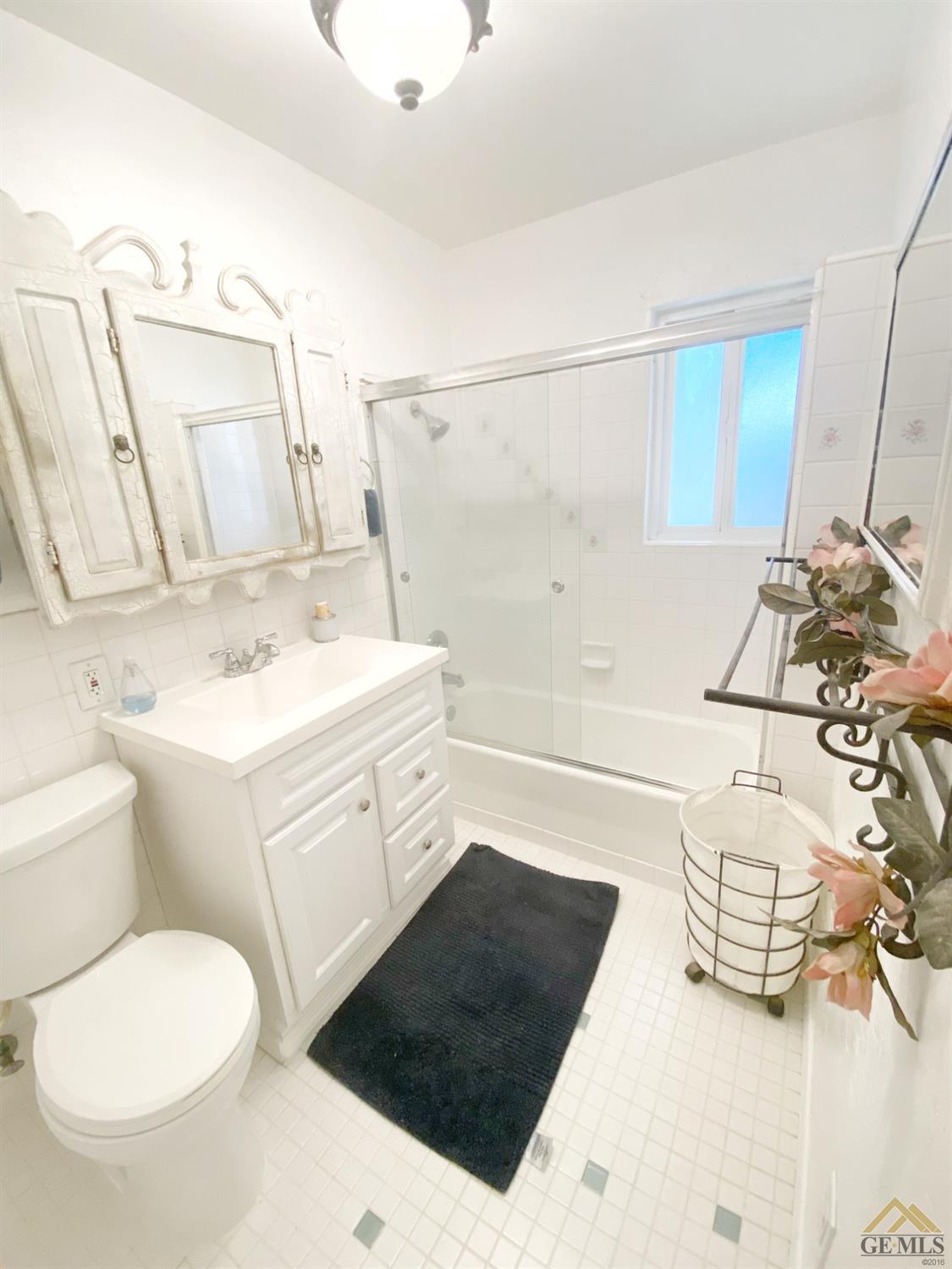 Undisclosed Address Wasco, CA 93280 - Photo 37 of 40 a bathroom with a sink a toilet and shower