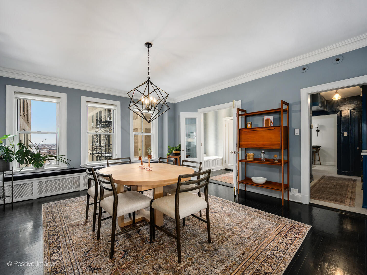 3530 North Lake Shore Drive, Unit 11B Chicago, IL 60657 - Photo 11 of 24 a view of a dining room with furniture window and wooden floor